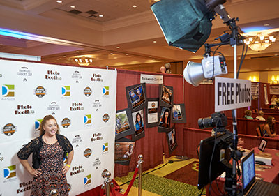 step and repeat photo station with prints